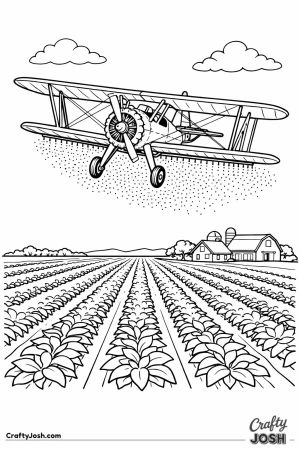 Stearman style crop duster biplane spraying over crop rows