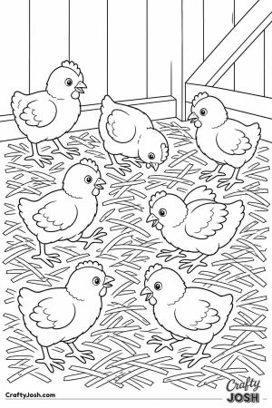 Chicks playing in a pile of straw