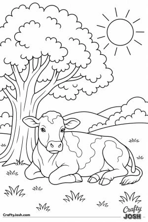 Cow lying in the shade of a big tree