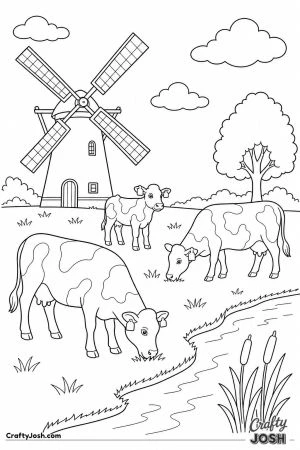 Cows grazing by a windmill