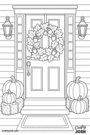Front door with a leaf wreath and pumpkins