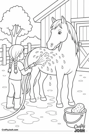 Girl washing a horse with a hose in the yard